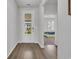 Hallway view to bedroom features white door and lovely neutral paint at 553 Pier Ct., Longs, SC 29568
