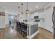 Bright, open kitchen featuring a large island, modern appliances, and sleek countertops at 553 Pier Ct., Longs, SC 29568