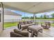 Outdoor patio with stylish furniture and a serene view of the backyard at 553 Pier Ct., Longs, SC 29568