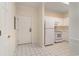 Entrance into a kitchen with white appliances and tile floor at 5750 Oyster Catcher Dr. # 531, North Myrtle Beach, SC 29582