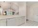 Well-lit kitchen with white cabinets, appliances, and countertops, open to the living area at 5750 Oyster Catcher Dr. # 531, North Myrtle Beach, SC 29582
