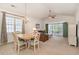 Inviting living area open to the dining room, with a ceiling fan and sliding glass doors to the patio at 5750 Oyster Catcher Dr. # 531, North Myrtle Beach, SC 29582