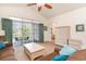 Inviting living area with neutral tones, ceiling fan, access to balcony, and a glimpse into adjacent rooms at 5750 Oyster Catcher Dr. # 531, North Myrtle Beach, SC 29582