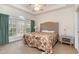 Serene bedroom featuring a large window, tray ceiling, and soft lighting for a relaxing ambiance at 5750 Oyster Catcher Dr. # 531, North Myrtle Beach, SC 29582