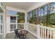 Relaxing covered patio with seating, offering a view of the surrounding trees and golf course at 5750 Oyster Catcher Dr. # 531, North Myrtle Beach, SC 29582