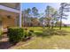 Expansive backyard with lush greenery and mature trees, providing a serene and private outdoor space at 5822 Longwood Dr. # 104, Murrells Inlet, SC 29576