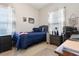Comfortable bedroom with a full sized bed, neutral walls and natural light at 5822 Longwood Dr. # 104, Murrells Inlet, SC 29576