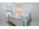 Cozy bedroom featuring a white bed frame and neutral walls at 5822 Longwood Dr. # 104, Murrells Inlet, SC 29576