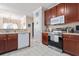 Bright kitchen showcases wood cabinets, stainless appliances and neutral countertops with seamless flow at 5822 Longwood Dr. # 104, Murrells Inlet, SC 29576