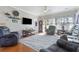 Comfortable living room featuring hardwood floors, modern reclining chairs, and a stylish area rug under ceiling fan at 5822 Longwood Dr. # 104, Murrells Inlet, SC 29576