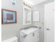This bathroom includes a vanity with cabinets and drawers, a toilet, and an artful decor at 5905 S Kings Hwy. # 1816 Rt, Myrtle Beach, SC 29575
