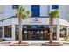 Renaissance Tower building entrance featuring palm trees and glass doors reflecting the beautiful surroundings at 5905 S Kings Hwy. # 1816 Rt, Myrtle Beach, SC 29575