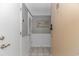 Hallway featuring neutral colors, beautiful picture, and ceramic tile flooring with two entry doors at 5905 S Kings Hwy. # 1816 Rt, Myrtle Beach, SC 29575