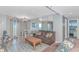 Living room featuring tile and wood floors, contemporary furniture, large mirror and an ocean view at 5905 S Kings Hwy. # 1816 Rt, Myrtle Beach, SC 29575