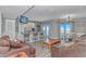 Open living space featuring a breakfast bar, balcony access with a view, and contemporary furniture at 5905 S Kings Hwy. # 1816 Rt, Myrtle Beach, SC 29575