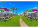 Outdoor recreation area featuring a playground, picnic tables, and green space under a sunny sky at 5905 S Kings Hwy. # 1816 Rt, Myrtle Beach, SC 29575