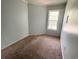 The comfortable bedroom is filled with natural light from a large window, creating a cozy retreat at 600 65Th Ave. N # 8, Myrtle Beach, SC 29572