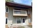 Exterior shot of condo with balcony, white trim, modern windows, and muted stucco siding at 600 65Th Ave. N # 8, Myrtle Beach, SC 29572