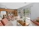 Inviting living room with built-in shelving and glass sliding doors to an outdoor deck at 6401 N Ocean Blvd., Myrtle Beach, SC 29572