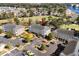 Aerial view of condo buildings overlooking a golf course, a lake and other homes in a well-maintained community at 703 Riverwalk Dr. # 303, Myrtle Beach, SC 29579