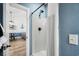 Streamlined bathroom showcasing a walk-in shower and a view into a living space, blending functionality with modern design at 703 Riverwalk Dr. # 303, Myrtle Beach, SC 29579