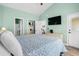 Comfortable bedroom featuring a double bed and a view to other rooms, seamlessly connecting relaxation and accessibility at 703 Riverwalk Dr. # 303, Myrtle Beach, SC 29579