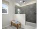 Modern bathroom with glass-enclosed shower and tiled walls, plus a stylish wooden bench at 8204 S Highway 905, Longs, SC 29568