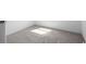 Simple bedroom with plush carpet and sunlit floor, offering a cozy and minimalist appeal at 8204 S Highway 905, Longs, SC 29568