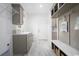 Functional mudroom area with storage cabinets, sink, bench, and easy access to the outdoors at 8204 S Highway 905, Longs, SC 29568