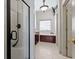 Elegant bathroom featuring a glass shower, soaking tub, and neutral tiling at 853 Bluffview Dr., Myrtle Beach, SC 29579
