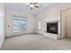 A bedroom featuring a fireplace, neutral walls, plush carpet, and double doors for natural light at 853 Bluffview Dr., Myrtle Beach, SC 29579