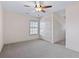 Bright bedroom with plush carpet, a window, and large closet space at 853 Bluffview Dr., Myrtle Beach, SC 29579
