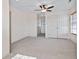 Cozy bedroom with plush carpet, a window, and double door closet at 853 Bluffview Dr., Myrtle Beach, SC 29579