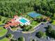 Aerial view of a community pool, playground, tennis courts and clubhouse at 853 Bluffview Dr., Myrtle Beach, SC 29579