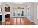 Elegant dining area with hardwood floors, chandelier, and access to the kitchen and outdoors at 853 Bluffview Dr., Myrtle Beach, SC 29579