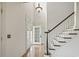 Bright foyer with hardwood floors, a staircase, and natural light from the front door at 853 Bluffview Dr., Myrtle Beach, SC 29579