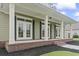 The front porch has large columns, white trim, brick accents, and double doors at 853 Bluffview Dr., Myrtle Beach, SC 29579