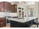 Gourmet kitchen features stainless steel appliances, a spacious island, and elegant dark wood cabinetry at 853 Bluffview Dr., Myrtle Beach, SC 29579