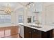 Spacious kitchen features a large island with marble countertops and a view of the fireplace at 853 Bluffview Dr., Myrtle Beach, SC 29579