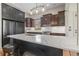 Beautiful kitchen with a large island, custom cabinets, and modern lighting fixtures at 853 Bluffview Dr., Myrtle Beach, SC 29579