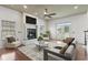Bright and airy living room with fireplace, hardwood floors, and an abundance of natural light at 853 Bluffview Dr., Myrtle Beach, SC 29579