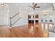 Open-concept living area featuring hardwood floors, a staircase, and view to the kitchen at 853 Bluffview Dr., Myrtle Beach, SC 29579