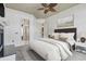 Comfortable main bedroom features neutral tones, a ceiling fan and a luxurious king bed at 853 Bluffview Dr., Myrtle Beach, SC 29579