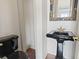 Stylish powder room featuring a unique black sink and toilet, complemented by an ornate mirror at 853 Bluffview Dr., Myrtle Beach, SC 29579