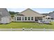 The backyard features a screened porch, shed, patio and lawn at 905 Sewing Bee Pl., Little River, SC 29566