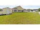 The backyard features a screened porch, shed, patio and lawn at 905 Sewing Bee Pl., Little River, SC 29566
