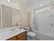 This bathroom features a mirror, sink, toilet, and shower/tub combo at 905 Sewing Bee Pl., Little River, SC 29566
