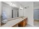 Bathroom featuring a countertop sink, large mirror, vanity lights, and tile floor at 905 Sewing Bee Pl., Little River, SC 29566