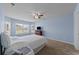 Comfortable bedroom with carpet, ceiling fan, and bright natural light from a bay window at 905 Sewing Bee Pl., Little River, SC 29566