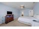 Bedroom featuring carpet, ceiling fan, dresser, and large bed at 905 Sewing Bee Pl., Little River, SC 29566
